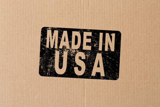 Made in USA symbol engraved on wooden board.