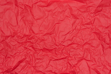 Crumpled red paper texture. Vibrant background