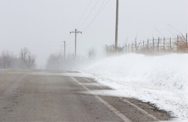 Blowing Snow Covered Country Road in the Winter