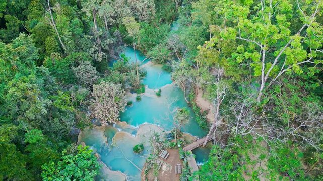 Beautiful Drone Video of Kuang Si Waterfalls in Laos, turquoise color silky waterfall in luang prabang travel video