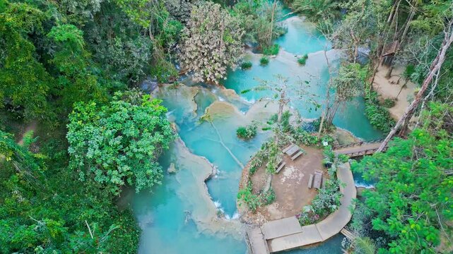 Beautiful Drone Video of Kuang Si Waterfalls in Laos, turquoise color silky waterfall in luang prabang travel video