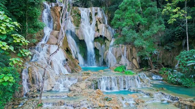 Beautiful Drone Video of Kuang Si Waterfalls in Laos, turquoise color silky waterfall in luang prabang travel video
