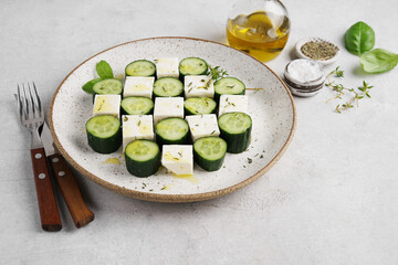 serving of cucumber and feta cheese salad. vegetarian cuisine. Healthy food
