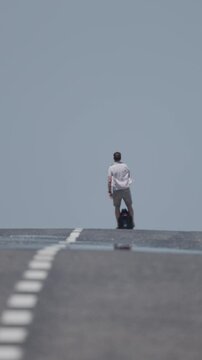 Man riding electric unicycle on empty road