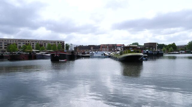 A view of an urban harbor on a cloudy day. Lille, France - May 21, 2025