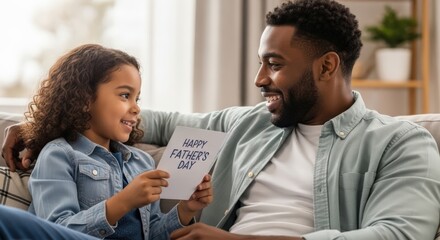 A heartwarming moment as a daughter gives her father a happy father's day card