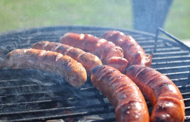 Sausages being cooked on the grill