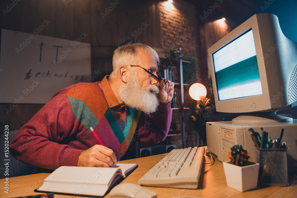 Poster elderly man working on a vintage computer in a cozy home office, showcasing technology and programmi