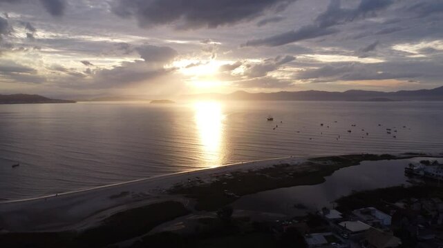 Scenic Sunset over Florian&oacute;polis Coastline with Boats and Sandbar &ndash; 4K Aerial