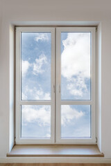 Modern white PVC window with double insulated panes in bright living space
