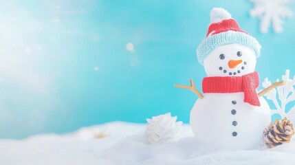 Fototapeta premium Snowman wearing a red scarf and blue hat against a winter backdrop