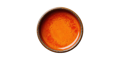 Round wooden bowl with orange sauce isolated on transparent background