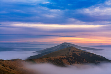 Beautiful sunrise of The Great Ridge at Mam Tor with cloud inversion. Peak District. England