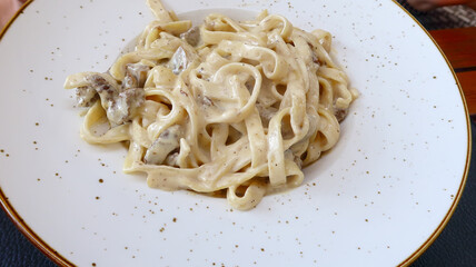A Carbonara dish with pasta and mushrooms