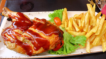 Roast Chicken ciovered in BBQ Sauce and served with chips