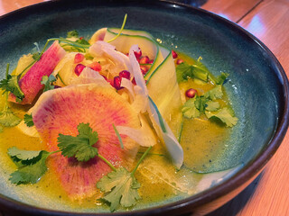 Gourmet Salad with Watermelon Radish, Zucchini Ribbons, and Pomegranate in Citrus Sauce
