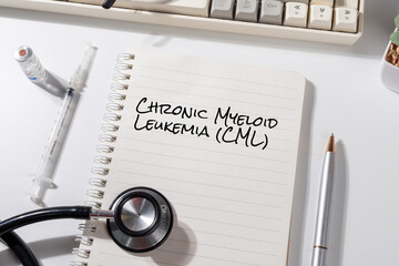 Doctor’s Desk with “Chronic Myeloid Leukemia (CML)” Note – Blood Cancer Alert with Pen and Medical Tools
