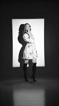 Beautiful young woman fashion model posing in studio