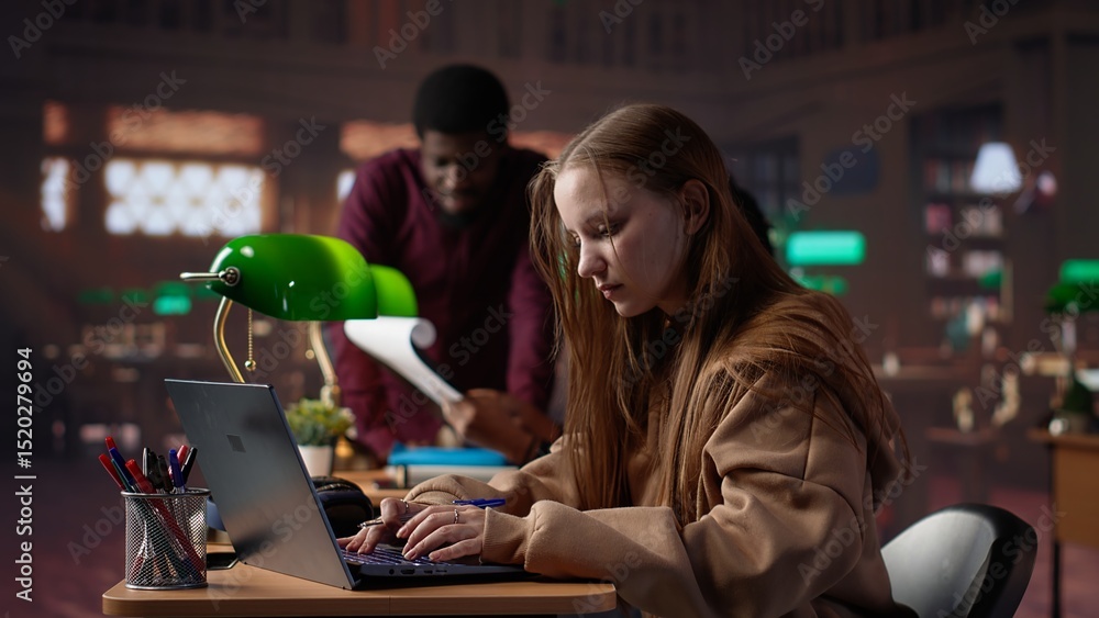 Poster college student captivated by literature assignment at the academic library on campus, working on ba