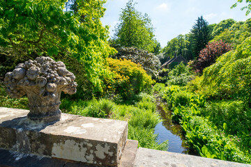 Victorian stone fruit basket on a bridge on a tourist trail. Woodland at Finlaystone Country Park Estate. Scotland. United Kingdom. 
