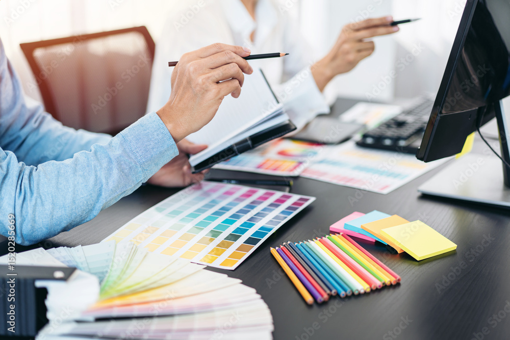 Poster two creative graphic designer team working on color selection and drawing on graphic tablet, color s
