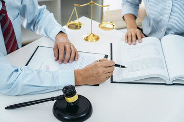 Male lawyer or notary consulting and discussion to businesswoman client in the office, Judge gavel...