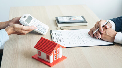 Real estate broker agent consulting the customer to a decision making sign insurance form agreement contract