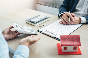Real estate broker agent consulting the customer to a decision making sign insurance form agreement contract