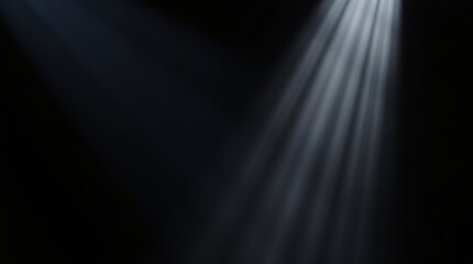 Obraz premium Bright light beam shining in a dark background, creating a dramatic contrast.