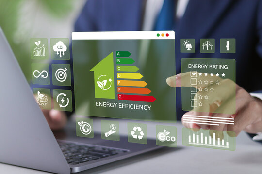 Energy efficiency Improvement concept, Eco-friendly homes for sustainable development. Businessman using laptop to energy efficiency rating assessment.