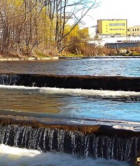 Water rapids. Stepped waterfall. Water in motion. Calm environment. Nature in an urban environment