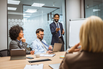 Focused businessman give a presentation to his colleagues in an office