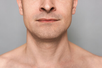Obraz premium Man after shaving on grey background, closeup