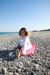 Girl in White Flowing Outfit Doing Yoga by Water