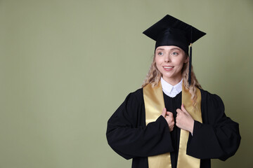 Happy student after graduation on green background. Space for text