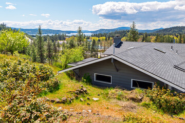 View of Lake Coeur d'Alene from a hilltop mid century home in Coeur d'Alene, Idaho, USA at autumn.