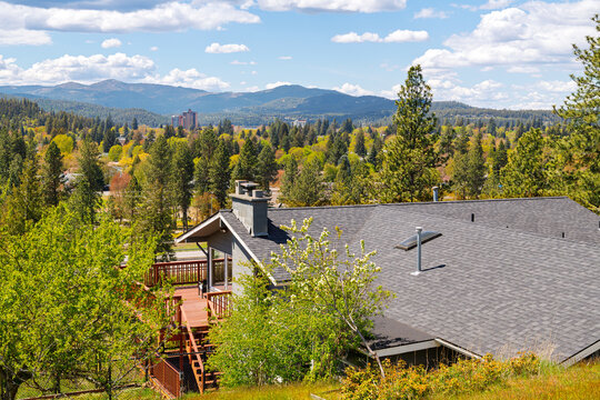 Fototapeta View from a mid century hillside home of McEuen Tower in the downtown district and the hills of the city of Coeur d'Alene, Idaho, from the Fernan Lake area.