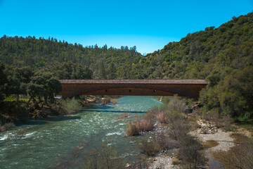 Bridgeport Covered Bridge Spanning South Yuba River with Forested Hills
