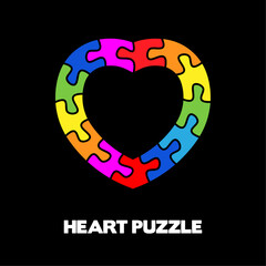 Colorful puzzle border heart. Vector isolated on black background.