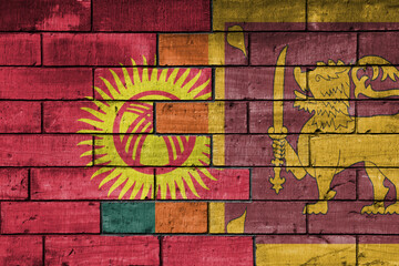 Fototapeta premium colourful painted big national flag of sri lanka and flag of kyrgyzstan on a massive old brick wall background. concept