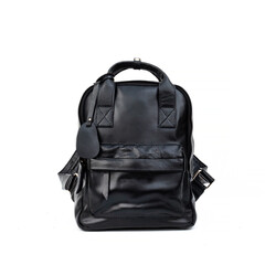 Naklejka premium Glossy black leather backpack isolated on white background, perfect for leather product catalog design