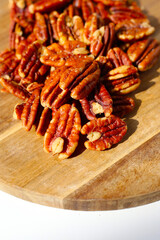 Delicious salted pecan nuts scattered.