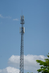 Signal tower or Mobile phone tower with dayligth sky. Telecommunication tower with 5G cellular network antenna. Global connection and internet network concept.