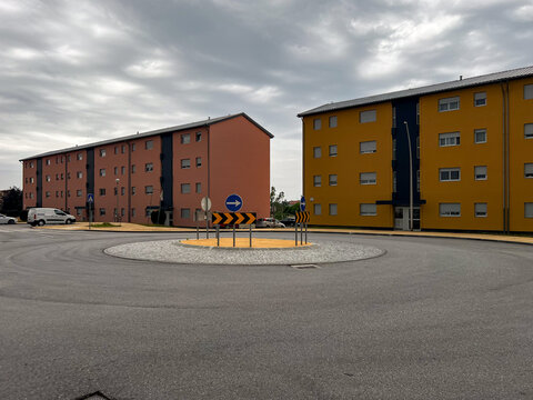 Modern residential buildings by a roundabout.