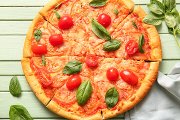Tasty pizza margarita on green wooden background