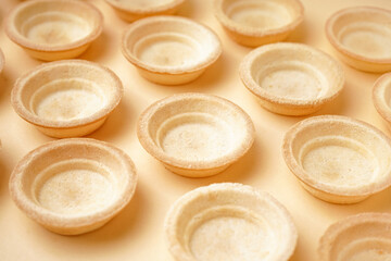 Homemade tartlets on yellow background