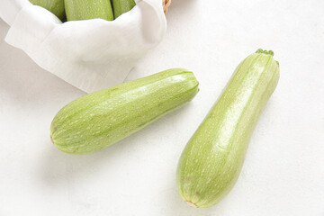 Fresh green zucchini on light background
