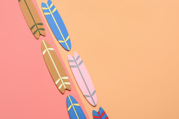 Different mini surfboards on color background