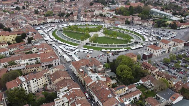 Aerial view of Prato della Valle in Padova, showcasing one of Europe&rsquo;s largest squares with its iconic elliptical canal and statues.