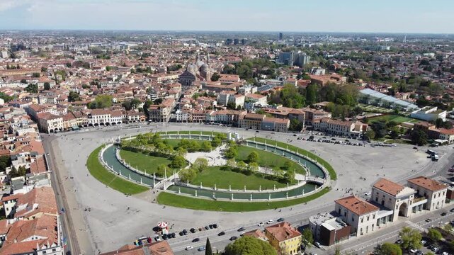 Aerial view of Prato della Valle in Padova, showcasing one of Europe&rsquo;s largest squares with its iconic elliptical canal and statues.